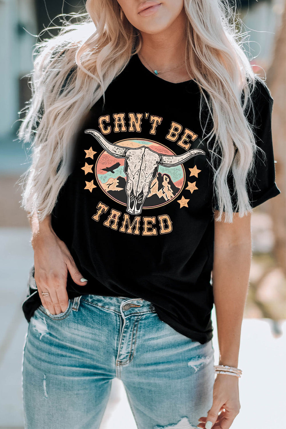 T-shirt à manches courtes avec imprimé graphique « CAN'T BE TAMED »