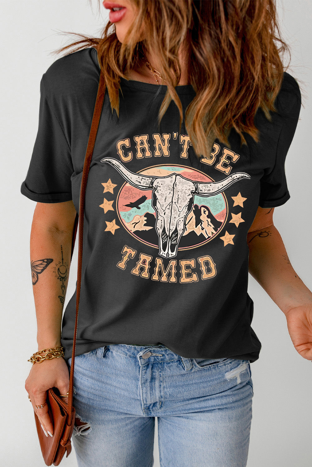 T-shirt à manches courtes avec imprimé graphique « CAN'T BE TAMED »